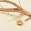 Collar girasol giratorio de oro